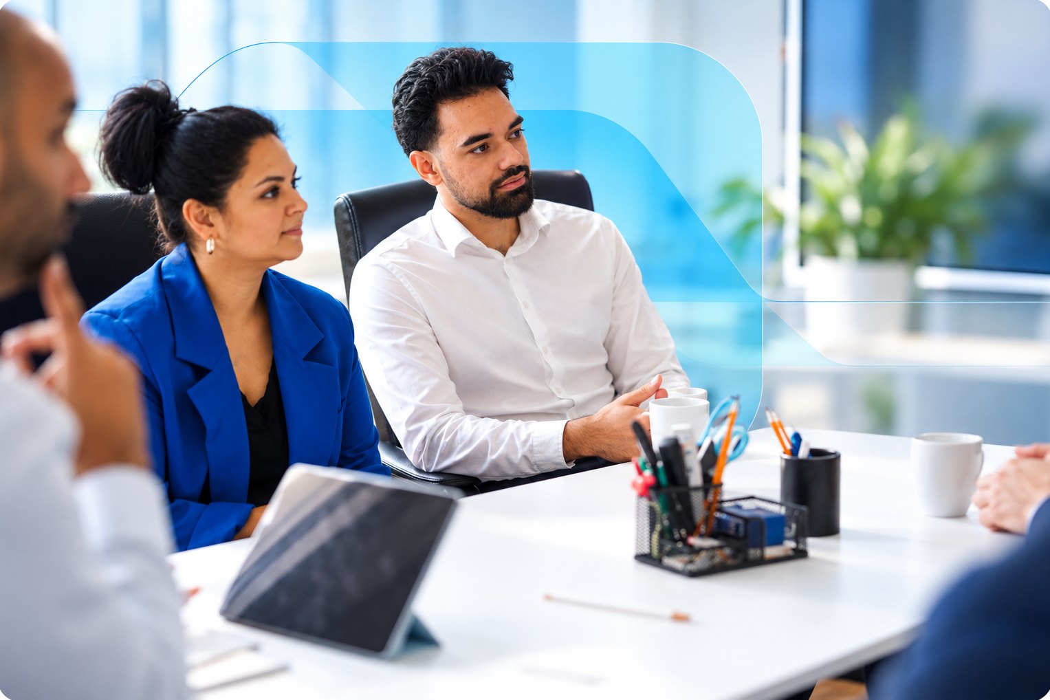 Technology professionals listening in a meeting